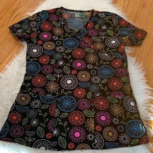 Woman’s multi color floral scrub top small